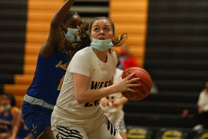 Joliet West’s Grace Walsh looks to take a shot against Joliet Central. Tuesday, Feb. 8, 2022, in Joliet.