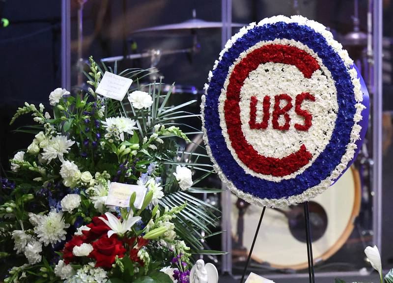 Among the flowers is a floral Chicago Cubs logo honoring former DeKalb County Sheriff Roger Scott’s love for the team Friday, March 7, 2025, during his memorial service at Bethany Road Bible Church in DeKalb. Scott, who was the county sheriff for 36 years, died on February 23 at the age of 78.