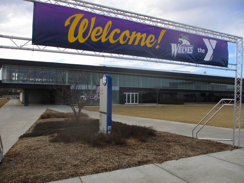 A banner outside the Joliet Junior College Event Center welcomes the Greater Joliet Area YMCA, which now has an office and will run programs at the college. Feb. 6, 2025