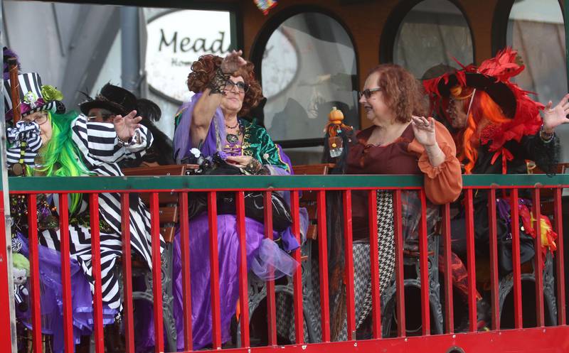 The Hocus Pocus Hags ride a trolley in the 6th annual Halloween parade on Saturday, Oct. 12, 2024 downtown Princeton.