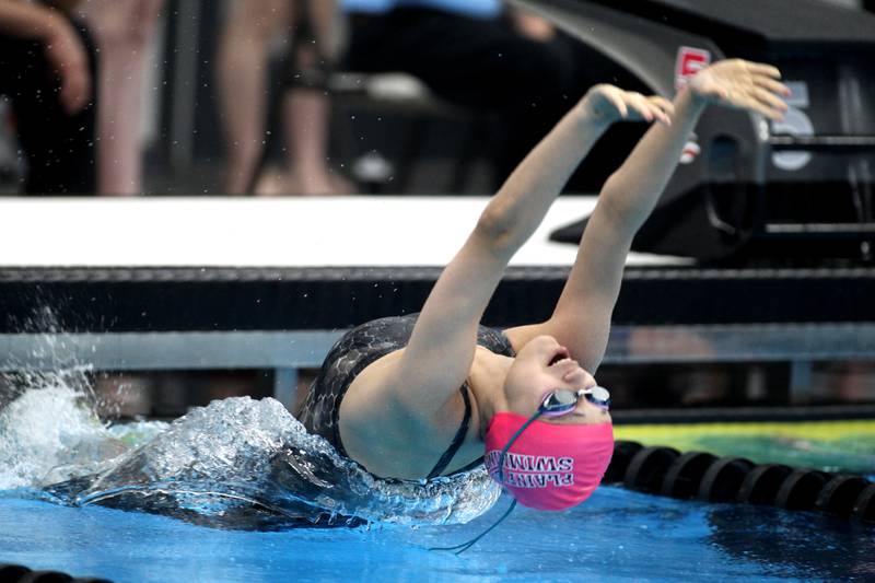 Plainfield North’s Mia Ceballos takes off from the block for the 100-yard backstroke during the IHSA Girls State Championship preliminaries at the FMC Natatorium in Westmont on Friday, Nov. 11, 2022.