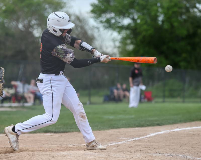 Sandwich's Jeffery Ashley (8) connects on a pitch during baseball game between Sandwich at Plano.  May 8, 2024