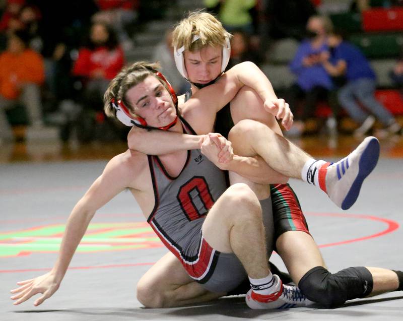 L-P's Reegan Kellett wrestles Ottawa's Nico Stanfill in the 132 weight match during a wrestling meet in Sellett Gymnasium on Wednesday Dec. 7, 2022 at L-P High School.