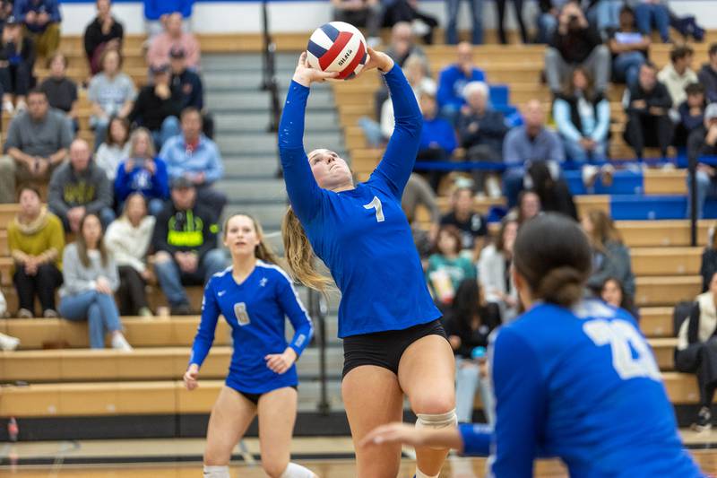 St. Charles North's Elia McCall sets the ball against Downers Grove North on Thursday Oct. 23, 2025 in St. Charles.