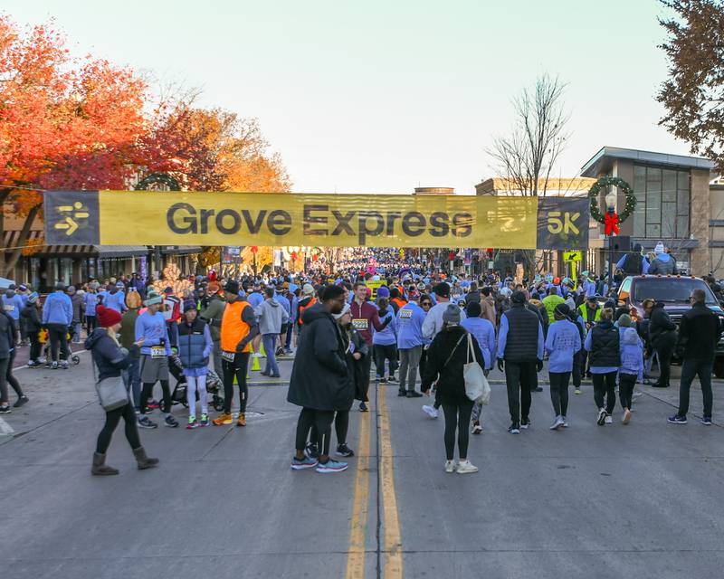 More than 6,160 participants line Main Street for the start of the Grove Express 5k race in downtown Downers Grove held on Thursday Nov. 23, 2023.