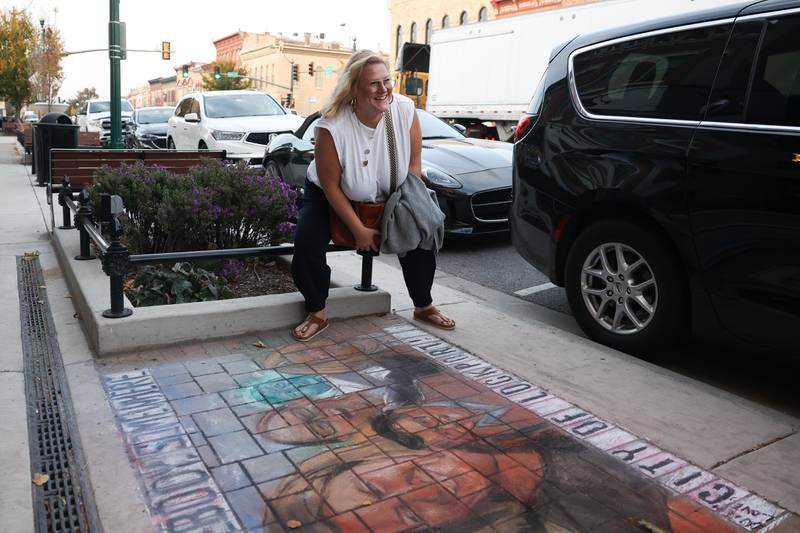 Actor Bridget Everett poses for a photo in front of the sidewalk art by Kevin Traynor at the HBO premiere of Somebody Somewhere at Roxy Lockport on Wednesday, Oct. 30, 2024 in Lockport.