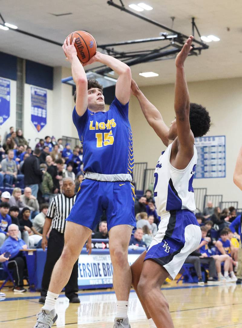 Lyons’ Max Hoffman (15) puts up a shot against Riverside Brookfield during a boys varsity basketball game on Friday, Jan. 26, 2024 in Riverside, IL.