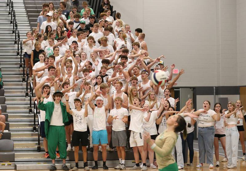 Seneca fans cheer on Seneca's Alyssa Zellers while serving against Marquette on Thursday, Sept. 19, 2024 at Seneca High School.
