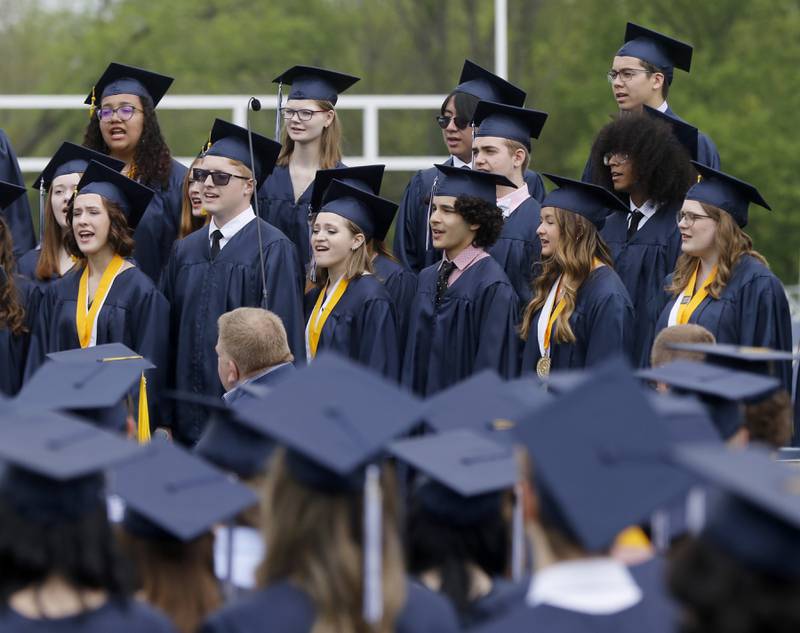 Graduate members of the A Cappella Singers perform “The Kid Inside” during the graduation ceremony for the class of 2023 at Cary-Grove High School in Cary.