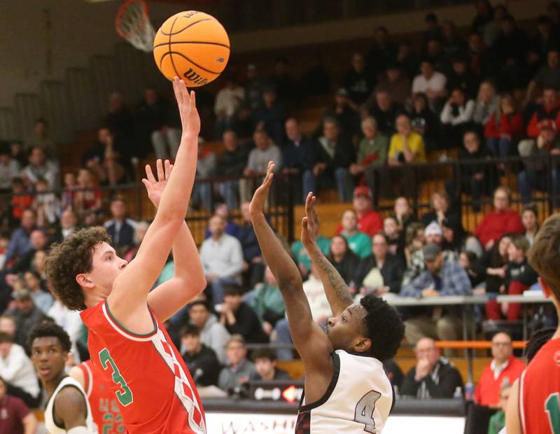 L-P's Mikey Hartman lets go of a fadeaway jump shot over Peoria's Anthoy Studuvant II during the Class 3A Sectional semifinal game on Wednesday, March 5, 2025 at Washington High School.