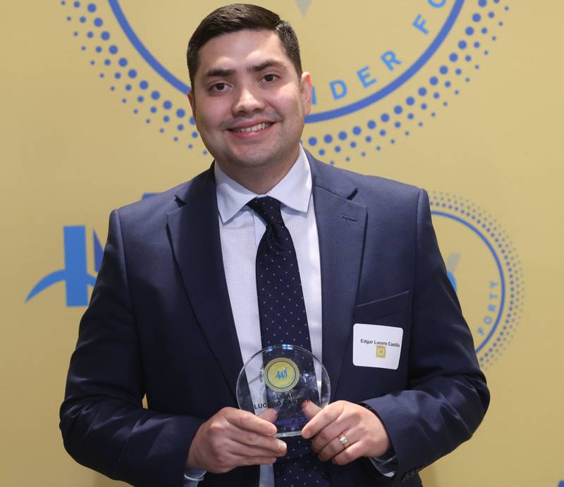 Edgar Lucero Castillo poses with his 40 Under Forty award during the Illinois Valley Chamber of Commerce Champions of Change Awards Night on Wednesday, May 6, 2026 at the Westclox Event Center in Peru.