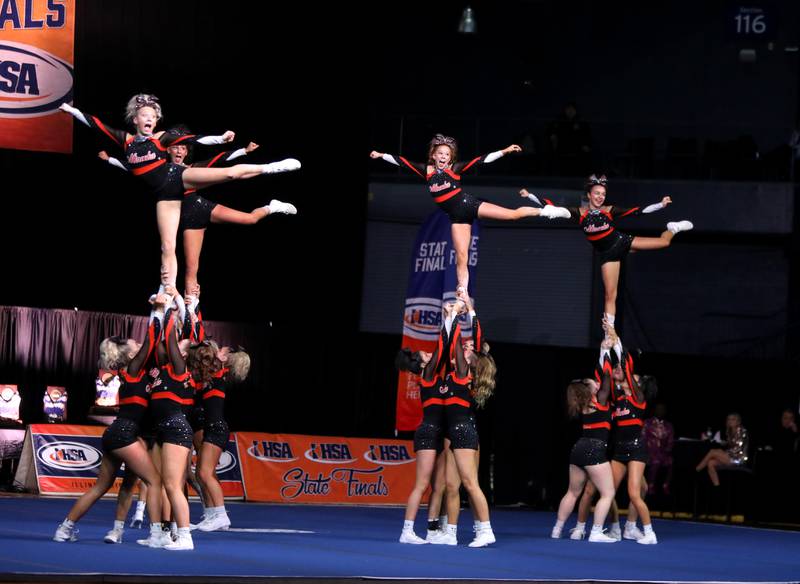 Members of the Minooka cheerleading team compete in the large team division of the IHSA State Finals on Saturday, Feb. 8, 2025 at Grossinger Motors Arena in Bloomington.