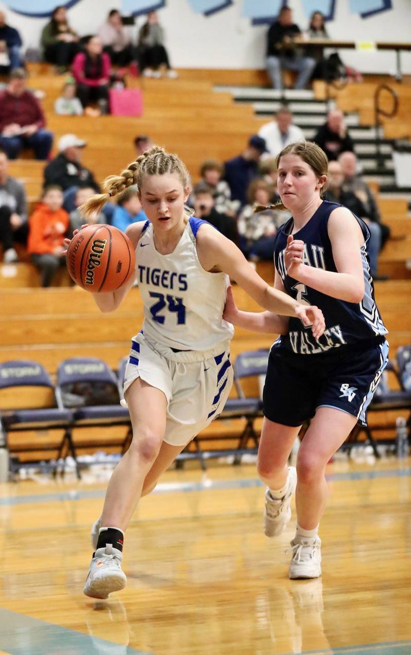 Princeton's Keighley Davis drives on Bureau Valley's Kate Salisbury during Monday's regional game at Bureau Valley.