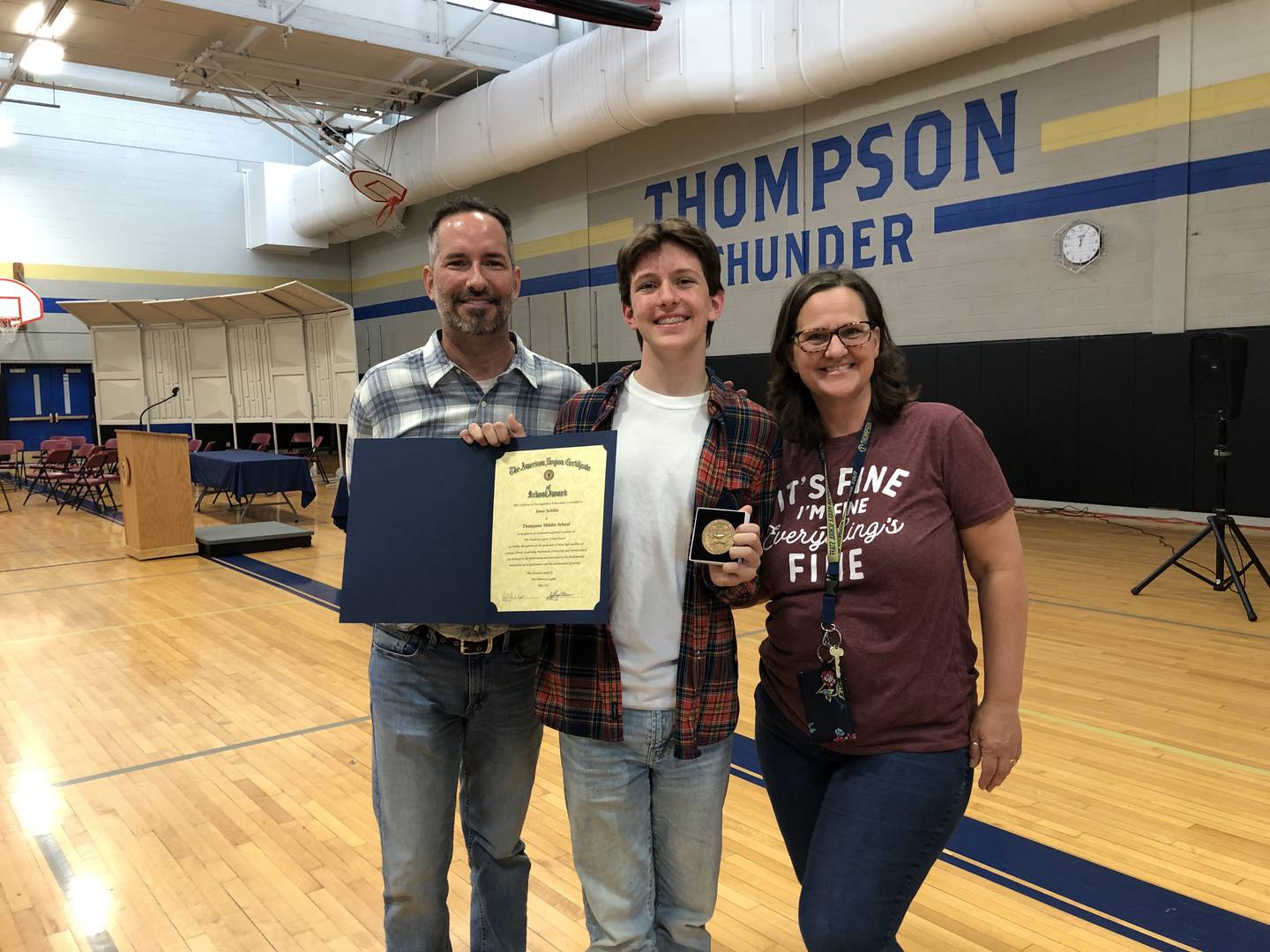 Jesse Schiltz, a student at Thompson Middle School, received the American Legion Award in May 2023.  
(Left to right: Ben, Jesse and Kathy Schiltz)