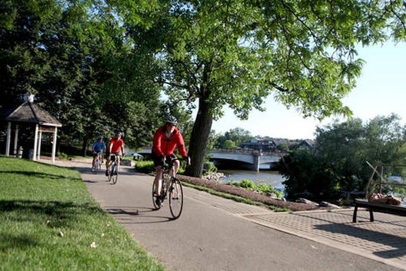 Bikers travel the Fox River Trail in Geneva.