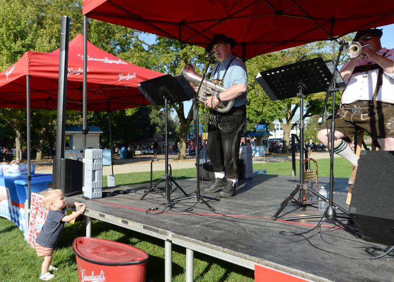 Oliver Peterson of Brookfield courseously watches while members of Alpine Thunder perform polka music for during the Octoberfest at Brookfield Zoo Saturday, Sept. 23, 2023.