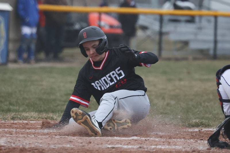 Bolingbrook’s Ryan Witt scores ahead of the throw against Joliet Central on Tuesday, March 21st. 2023.