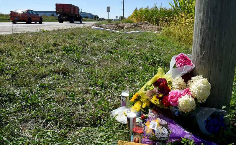 Flowers and candles have been placed near the site of a Thursday crash that killed South Elgin High School students and injured two others on Route 25 in Bartlett.