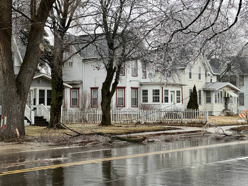 East Lincoln Highway between ninth and 11th streets was briefly closed Wednesday afternoon, Feb. 22, 2023 for downed live wires and a large tree branch blocking the roadway, according to the city of DeKalb. Wednesday brought with it consistent freezing rain.