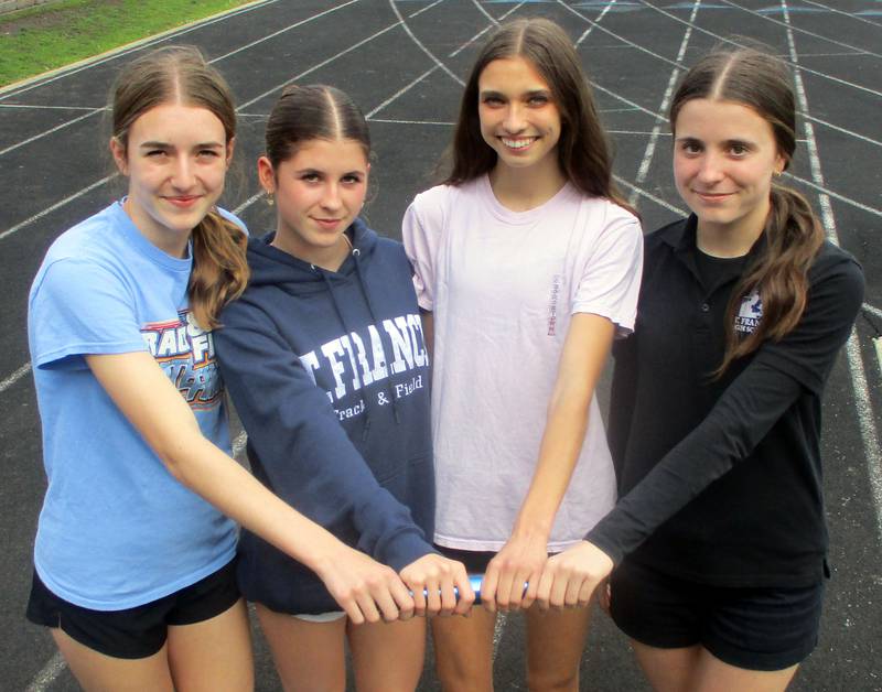 St. Francis' 4x800 relay team of  (from left) Allie Sheldon, Elena Mamminga,  Margaret Andrzejewski and Erin Hinsdale, who set a Class 2A state record last season, are back this spring but may focus on different events in Charleston.