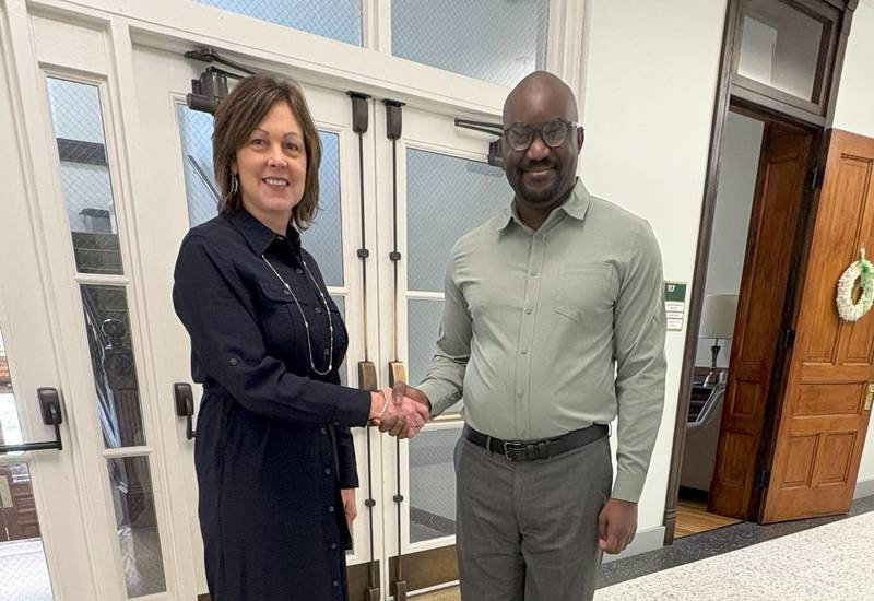 St. Bede Academy superintendent Eve Postula welcomes new director of mission advancement and major gifts Michel Massamba, a 2011 graduate of St. Bede.
