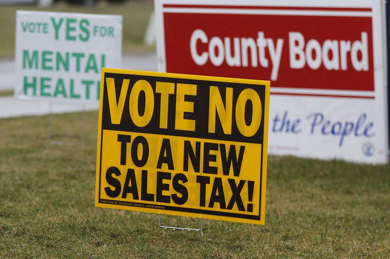 Campaign signs that line the driveway to the McHenry County Administration Building, an early voting site, on Friday, March 8, 2024, in Woodstock.