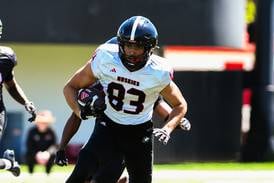 Suit and tie, ready to play: NIU tight end, Niles West grad Jason Fowler, doing more than dressing the part 