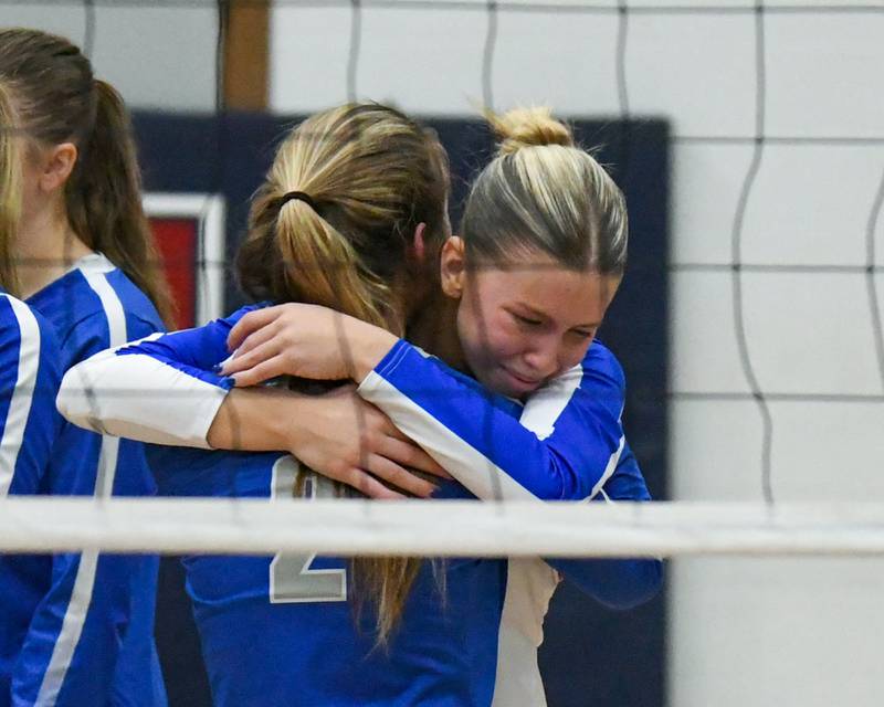 St. Charles North's Meg Kalenowski (5) gets a hug from teammate St. Charles North's Mary McNellis (2) after ending their season on Thursday Nov. 7, 2024, after dropping two games to Benet Academy in the 4A sectional title game held at West Aurora High School.