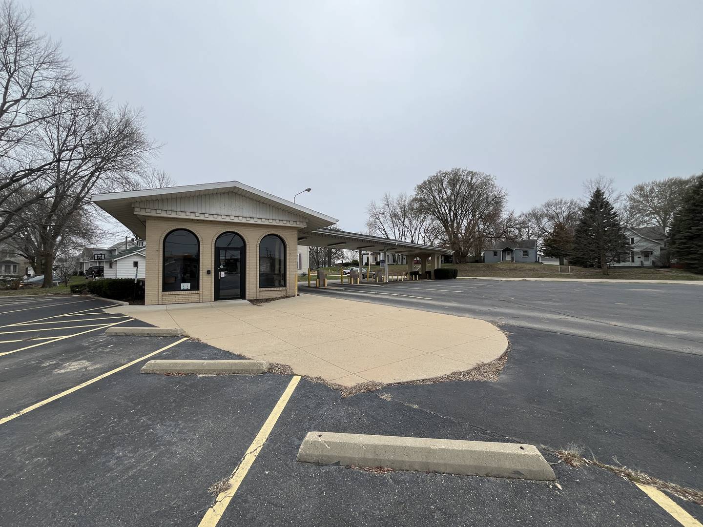 Coloma Townships newly appointed board is looking into the possibility of selling the 52,616 square foot property which includes a lobby area, multiple offices, teller windows, bank vault and a large on-site parking lot. The former US Bank's drive through area at 300-302 First Ave. in Rock Falls is pictured April 1, 2025.
