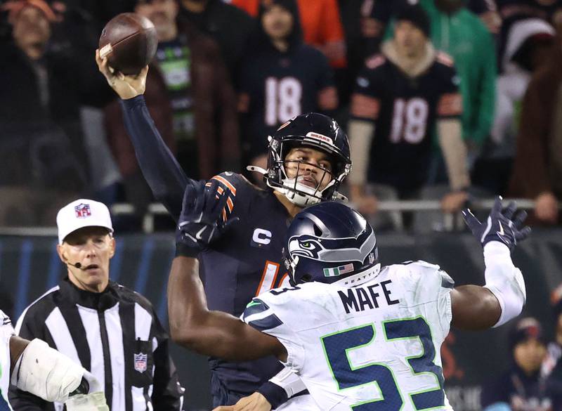 Chicago Bears quarterback Caleb Williams throws the ball over Seattle Seahawks linebacker Boye Mafe during their game Sunday, Dec. 26, 2024, at Soldier Field in Chicago.