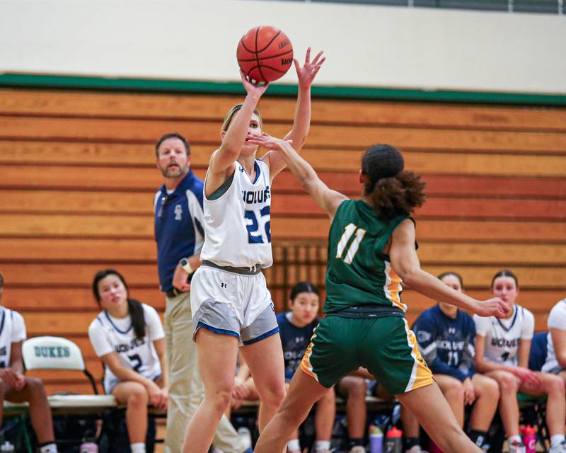 Oswego East's Jessica LeClaire (22) shoots a jumper at the York Thanksgiving Tournament. Nov 13, 2023.