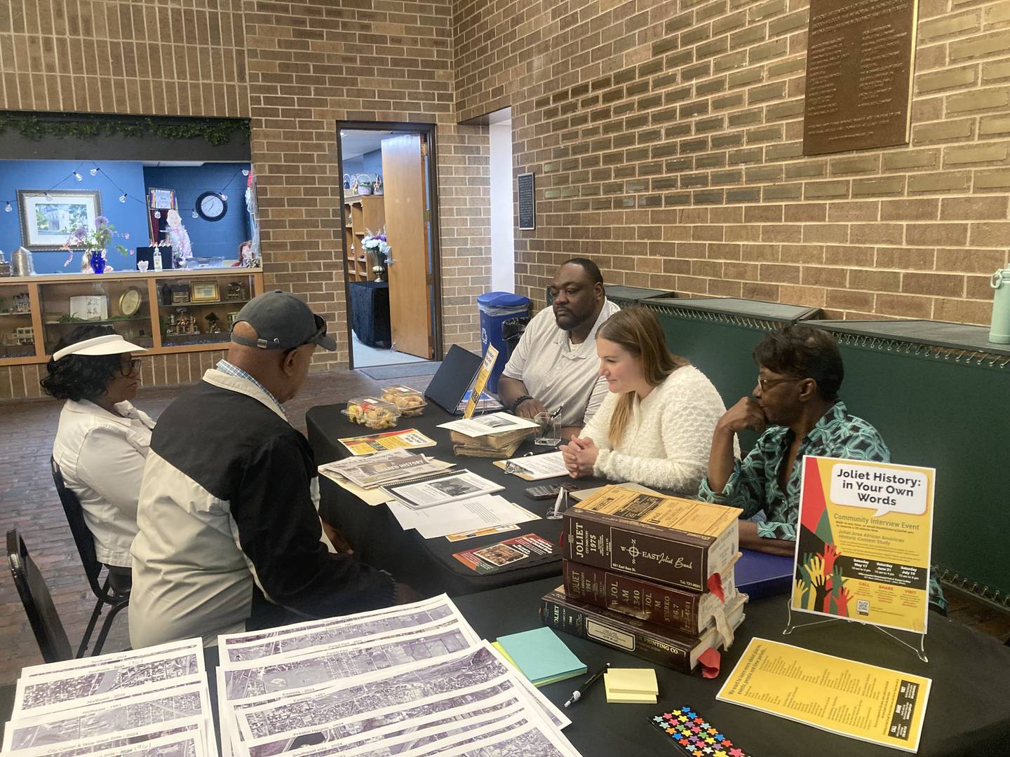 The Steering Committee for the Joliet Area African American Historic Context Study, Chris Parker, Elizabeth Blasius, and Julia Alexander conduct an interview with residents on Saturday, May 17, 2025.