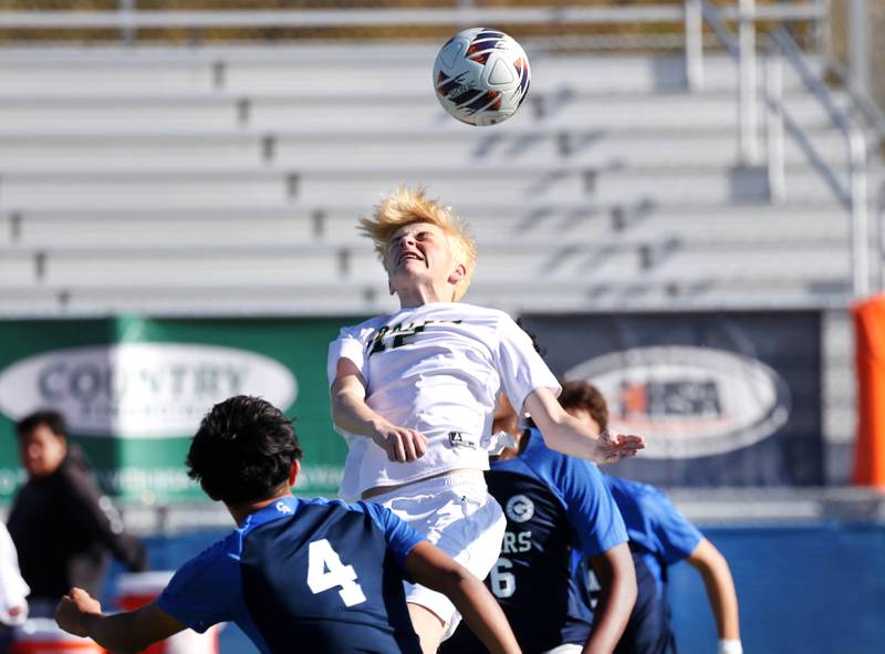 Coal City's Carter Hollis heads the ball over Chicago Academy's Daniel Delgado-Perez Friday, Nov. 7, 2025, during their Class 1A state third place game at Hoffman Estates High School.