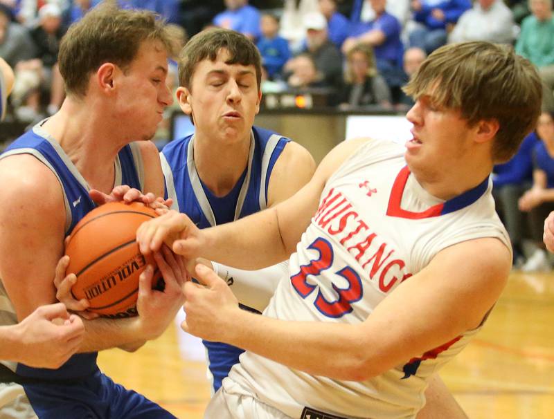 Princeton's Korte Lawson and Tyson Phillips take the ball away from Morrison's Carson Strating  during the Class 2A Regional final game on Friday, Feb. 23, 2024 at Erie-Prophetstown High School.