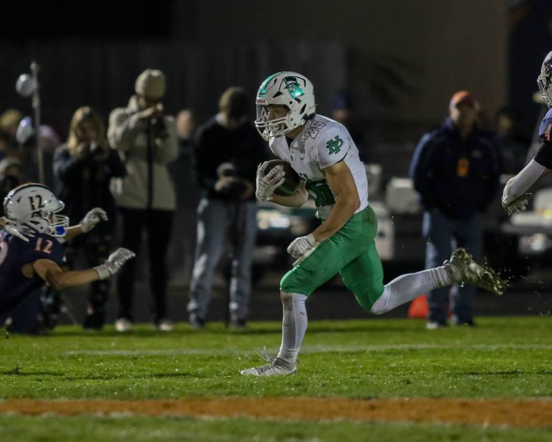 York's Henry Duda (26) runs with the ball during Class 8A second- round football game between York at Oswego on Friday, Nov 8, 2024  in Oswego.