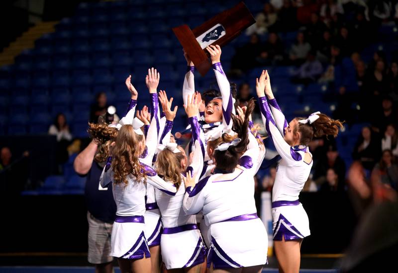 Members of the Wilmington cheerleading team celebrate their third-place finish in the small team division of the IHSA State Finals on Saturday, Feb. 8, 2025 at Grossinger Motors Arena in Bloomington.