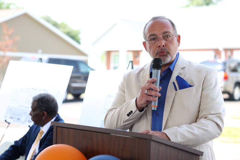 William Perakis, Kankakee County Housing Authority commissioner, welcomes the crowd during the West Harbor Residences ribbon cutting and street dedication ceremony on Wednesday, July 23, 2025.
