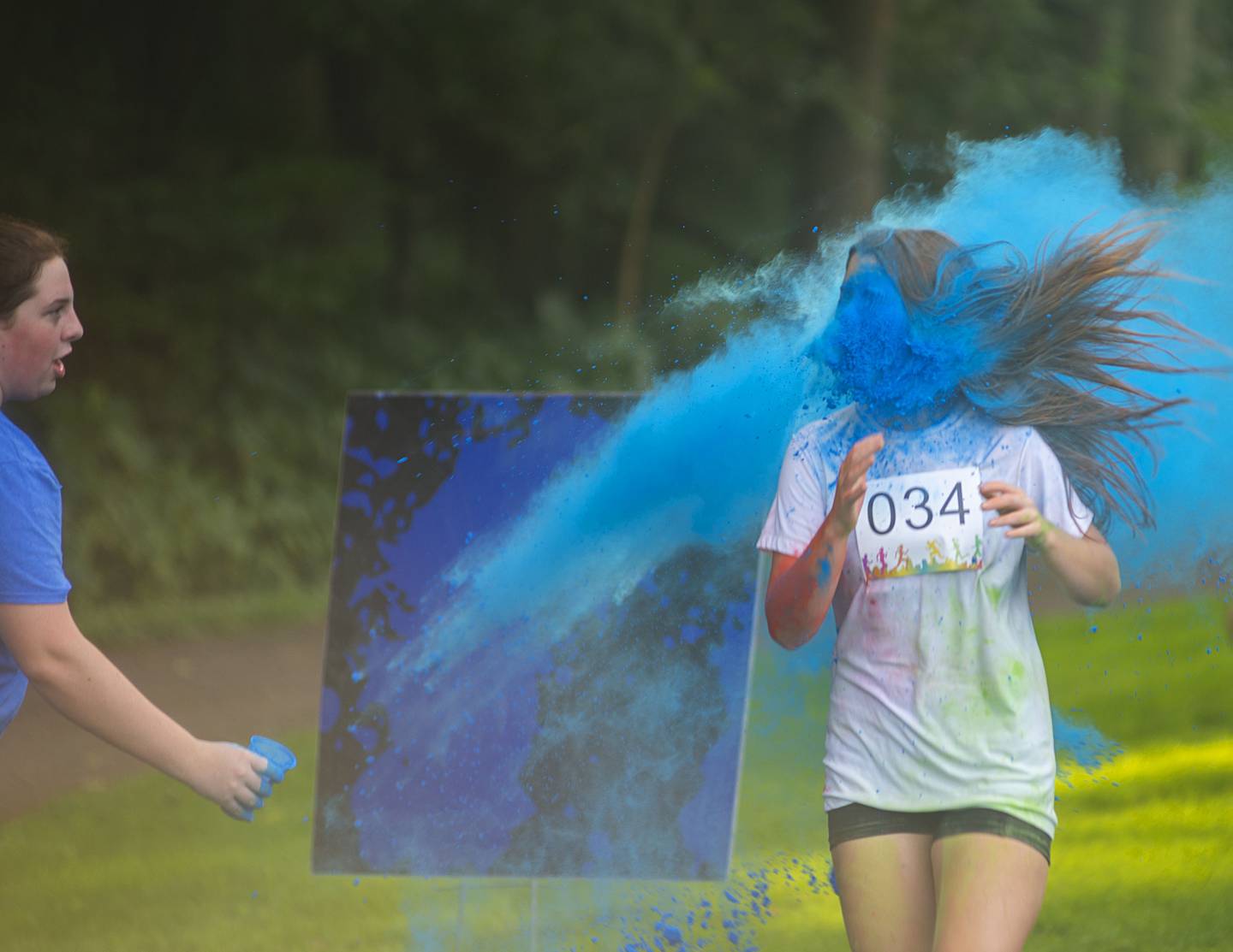 Bella Henson gets a face full of color Saturday, August 6, 2022 at Woodlawn.