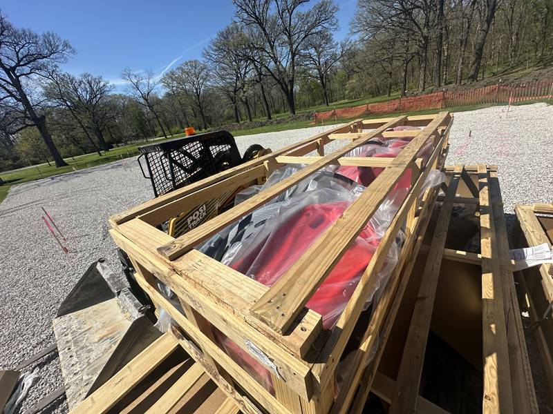 Equipment rests in pallets on the ground for Logan's Oasis playground on  Monday, April 20, 2026 at Marilla Park in Streator. The playground has been in the works for almost two years. The project is spearheaded by Melissa Crank and family members in memory of her late son, Logan Crank.
