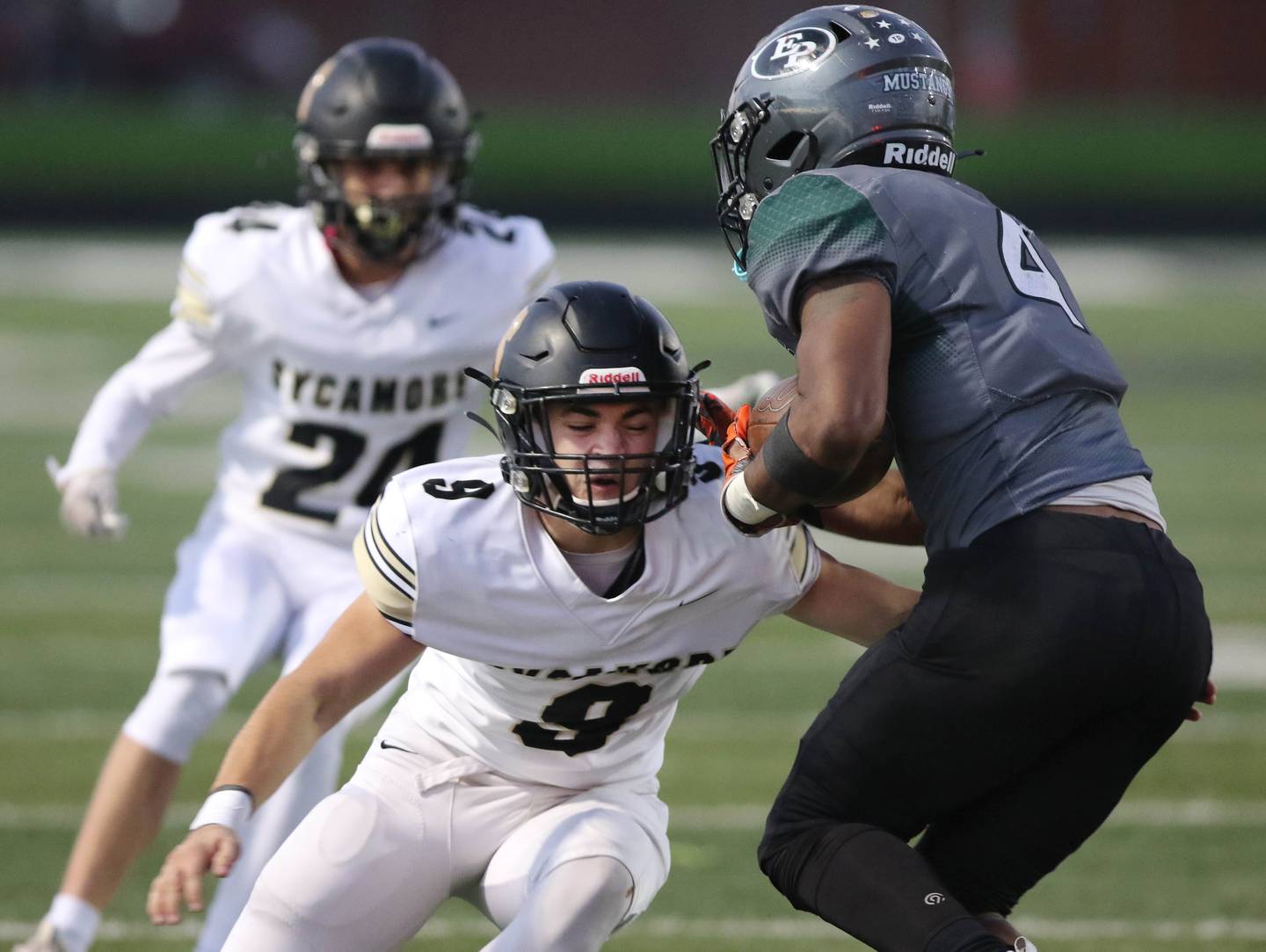 Sycamore's Dawson Alexander tackles Evergreen Park's Michael Torres Saturday, Oct. 30, 2021, during their IHSA Class 5A playoff opener at Evergreen Park High School.