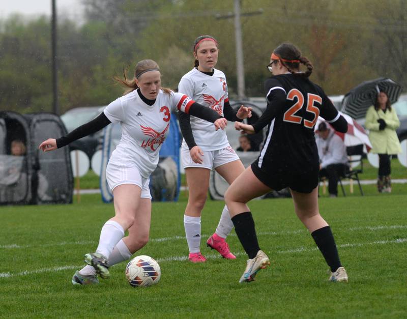 Oregon's Deborah Schmid (3) makes a move on Byron's Arianna Irvin on Thursday, April 18, 2024 at Byron High School. The Tigers won the game 2-1.