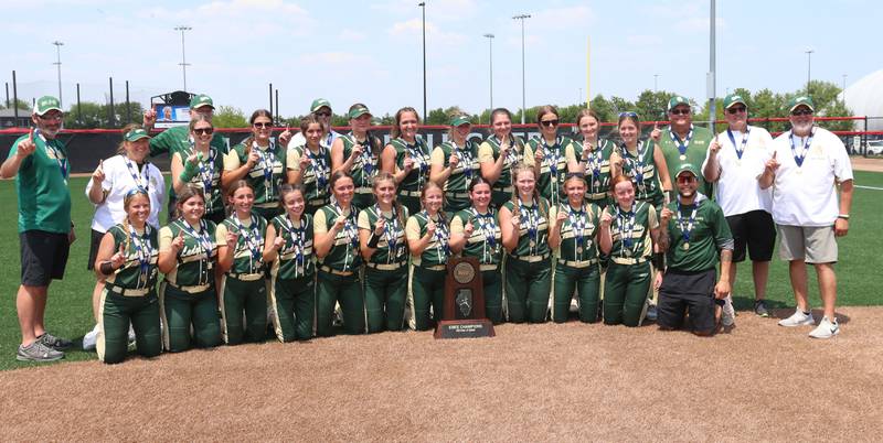 Members of the St. Bede Lady Bruins softball team pose with the Class 1A championship trophy after defeating Illini Bluffs in the Class 1A State championship game on Saturday, June 3, 2023 at the Louisville Slugger Sports Complex in Peoria.