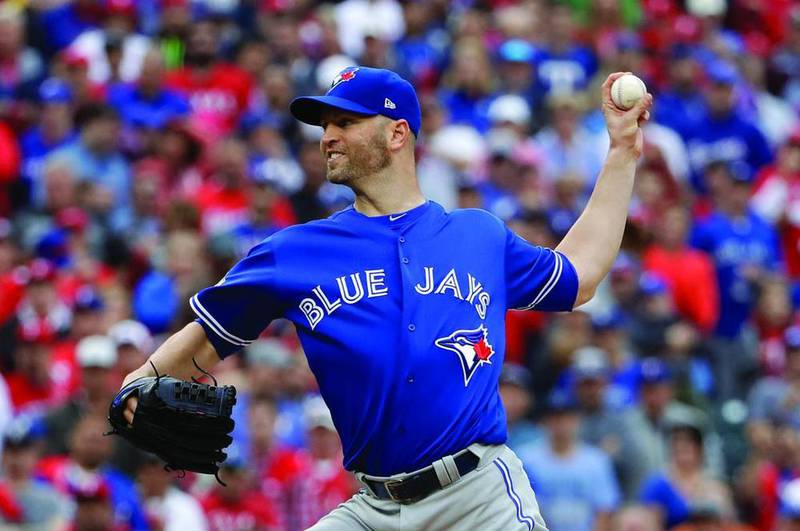 Blue Jays starter and Peru native J.A. Happ throws against the Rangers in the first inning of Game 2 of their American League Division Series on Friday in Arlington, Texas. (AP Photo/David J. Phillip)