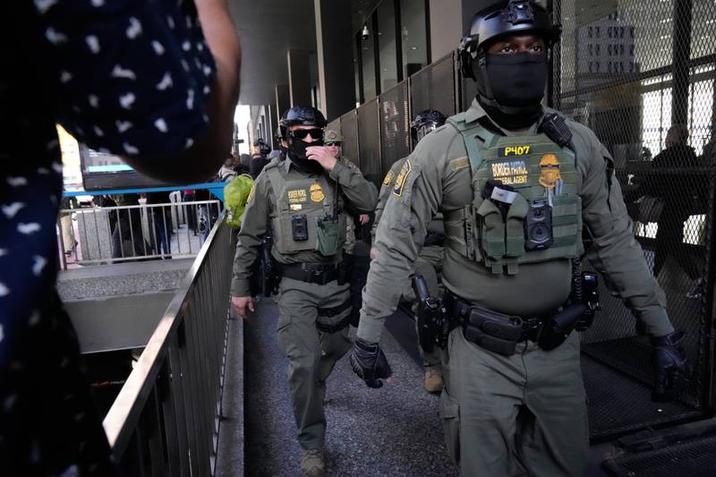 U.S. Customs and Border Patrol agents arrive to escort U.S. Customs and Border Patrol Gregory Bovino from federal court in Chicago, Tuesday, Oct. 28, 2025. (AP Photo/Nam Y. Huh)