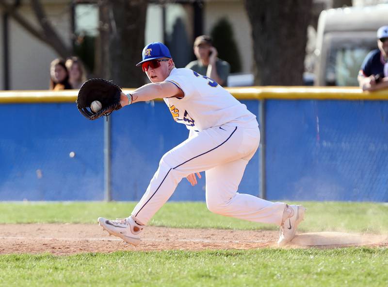Lyons Township's Sam Viniard (37) makes an out at first during the boys varsity baseball game between Lyons Township and Downers Grove North high schools in Western Springs on Tuesday, April 11, 2023.