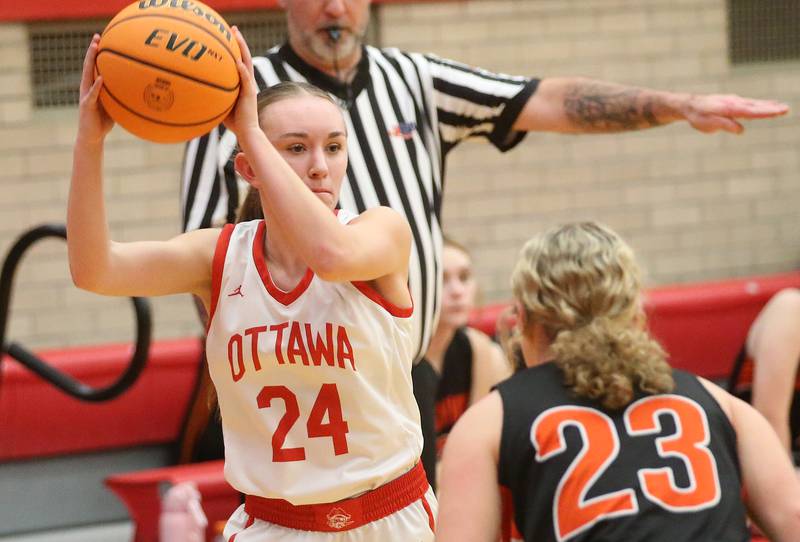 Ottawa's Ashlyn Ganiere looks to pass the ball around Sandwich's Bailey Frieders on Monday, Jan. 27, 2025 in Kingman Gym at Ottawa High School.