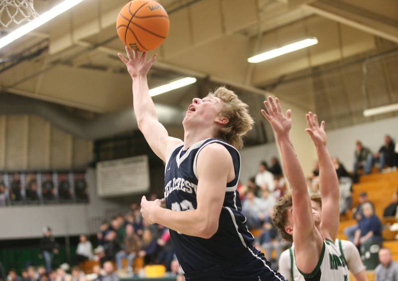 Fieldcrest's Jordan Heider lets go of a shot under the hoop against Midland on Wednesday, Feb. 19, 2025 at Midland High School.