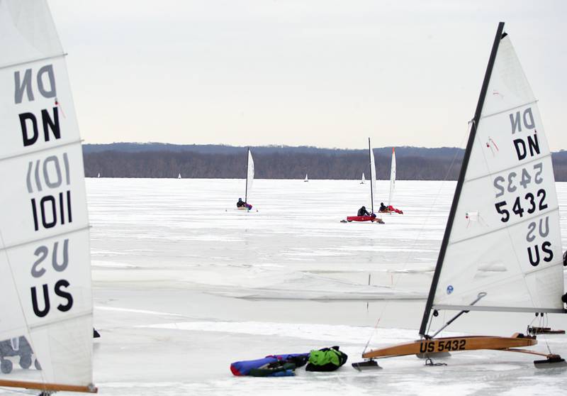 Ice Boat racers make their way to shore while racing in the 2022 DN US Ice Boat Nationals on Senachwine Lake on Thursday Jan. 27, 2022 near Putnam.