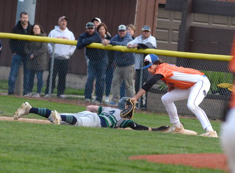 Eastland's Zy Haverland tags a River Ridge/Scales Mound player at first during the 1A Lena-Winslow Sectional on Wednesday, May 28, 2025.