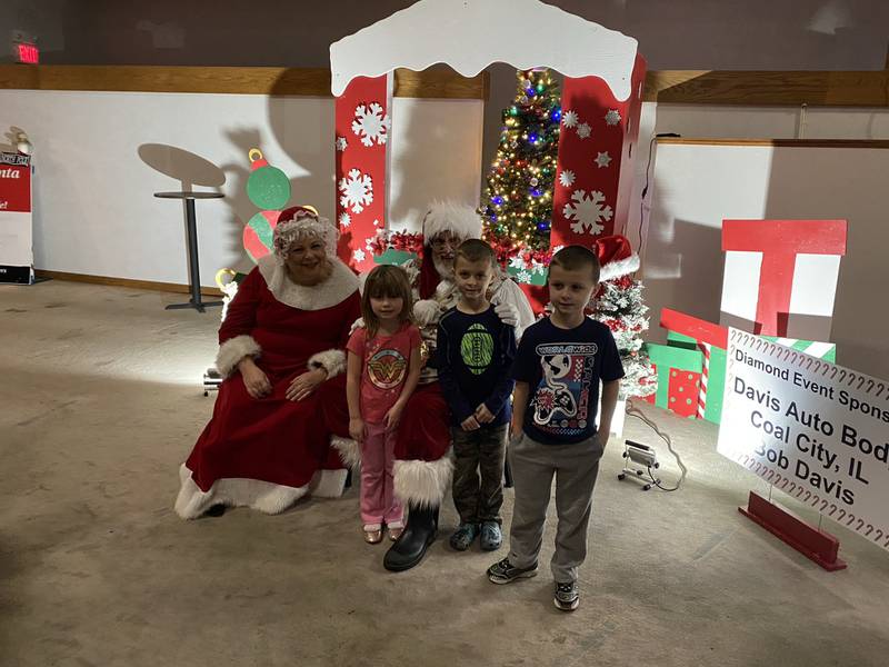 Santa and Mrs. Claus with Gunner, Adalynn, and Dillon.